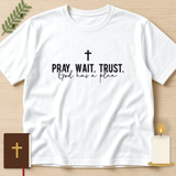 Pray Wait Trust God Has a Plan tee on a white shirt