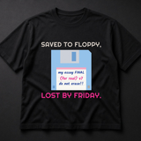 Black T-shirt printed with a pastel floppy disk labeled my essay FINAL and the words Saved to Floppy, Lost by Friday